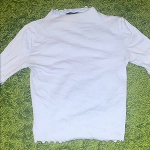 Lettuce hem mock neck top